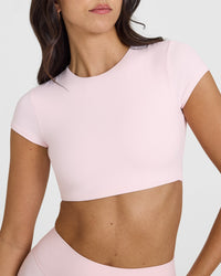 SoftMotion™ Short Sleeve Crop Top with White Logo | Ballet Pink
