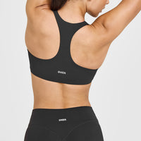 SoftMotion™ Sports Bra with White Logo | Soft Black