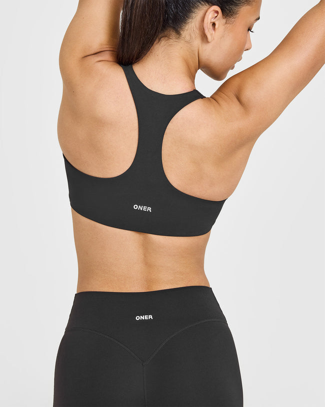 SoftMotion™ Sports Bra with White Logo | Soft Black