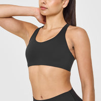 SoftMotion™ Sports Bra with White Logo | Soft Black