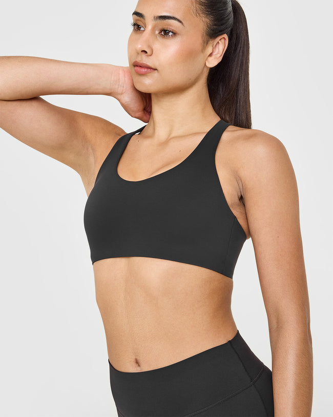 SoftMotion™ Sports Bra with White Logo | Soft Black