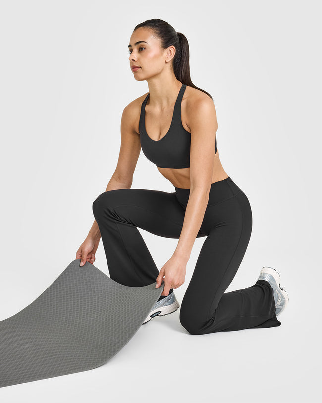 SoftMotion™ Sports Bra with White Logo | Soft Black