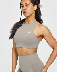 EasyLift™ High Neck Sports Bra with White Logo | Warm Sand