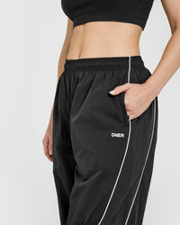 Oversized Piped Woven Straight Leg Track Bottoms | Soft Black