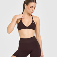 EnhanceLift™ Seamless Minimal Halter Neck Bralette with White Logo | Plum Brown