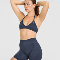 EnhanceLift™ Seamless Minimal Halter Neck Bralette with White Logo | True Blue