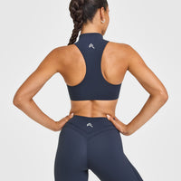 EasyLift™ Zip High Neck Sports Bra with White Logo | True Blue