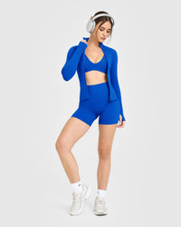 SoftMotion™ Scoop Back Bralette with White Logo | Light Cobalt Blue