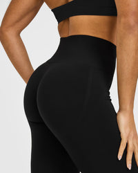 Effortless Seamless Flared Bottoms with White Logo | Black