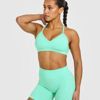 EnhanceLift™ Seamless Strappy Sports Bra with White Logo | Peppermint Green