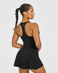 SoftMotion™ Racer Back Mid Vest with Built in Bra Shelf with White Logo | Black