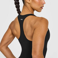SoftMotion™ Racer Back Mid Vest with Built in Bra Shelf with White Logo | Black