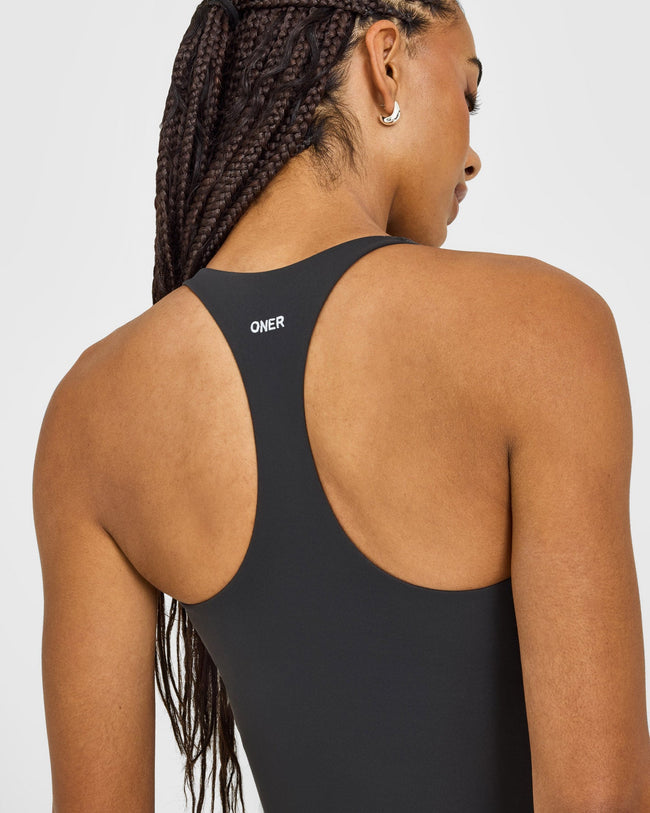 SoftMotion™ Racer Back Mid Vest with Built in Bra Shelf with White Logo | Coal