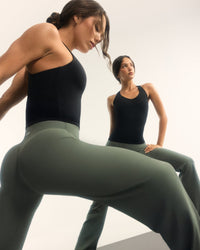 SoftMotion™ Racer Back Vest with Built in Bra Shelf with White Logo | Black