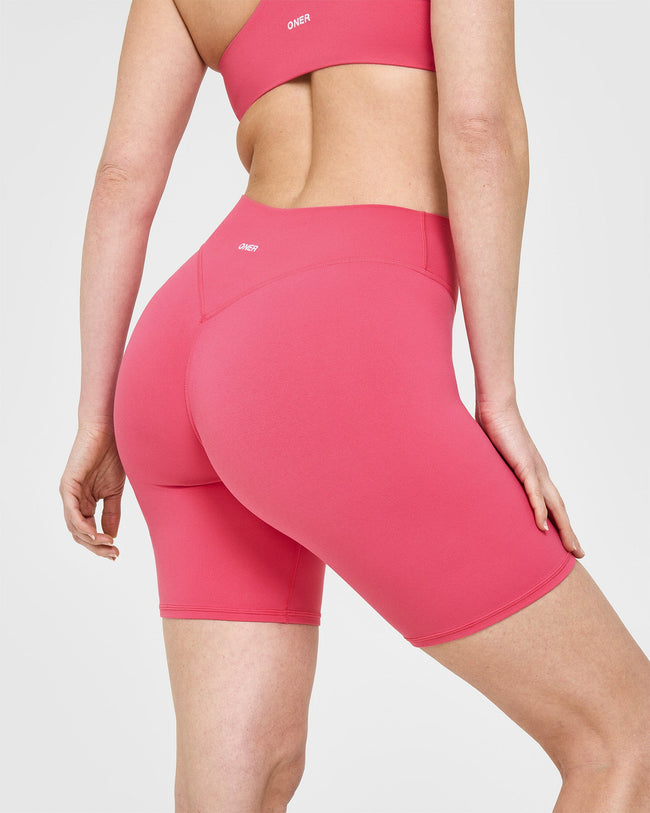 SoftMotion™ Cycling Shorts 8" with White Logo | Dark Velvet Pink