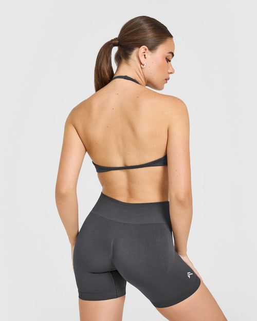 EnhanceLift™ Seamless Minimal Halter Neck Bralette with White Logo | Coal
