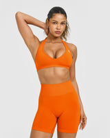 Effortless Seamless Halter Neck Sports Bra with White Logo | Flame Orange