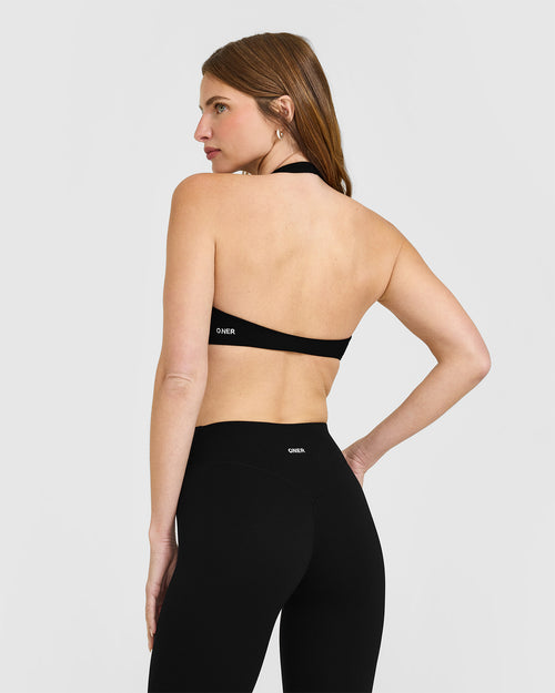 SoftMotion™ Minimal Halter Neck Bralette with White Logo | Black