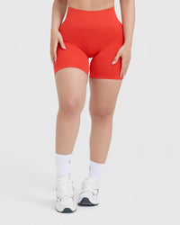 EffortlessLift™ Seamless Shorts with White Logo | Charged Orange
