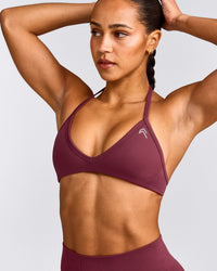 EnhanceLift™ Seamless Minimal Halter Neck Bralette with Gray Logo | Burnt Maroon