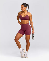 EnhanceLift™ Seamless Strappy Sports Bra with Gray Logo | Burnt Maroon Red