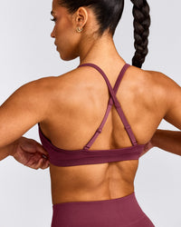 EnhanceLift™ Seamless Strappy Sports Bra with Gray Logo | Burnt Maroon Red