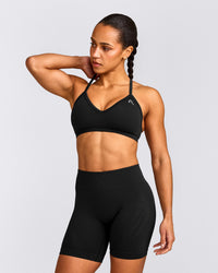 EnhanceLift™ Seamless Strappy Sports Bra with Gray Logo | Black