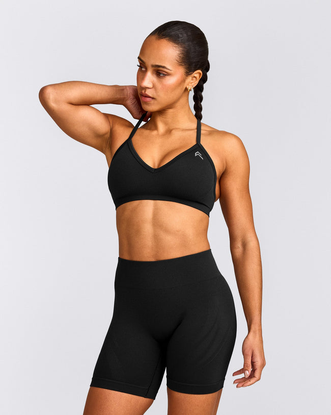 EnhanceLift™ Seamless Strappy Sports Bra with Gray Logo | Black
