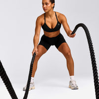 EnhanceLift™ Seamless Strappy Sports Bra with Gray Logo | Black