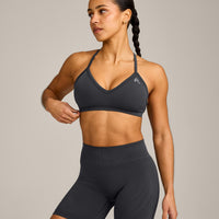 EnhanceLift™ Seamless Strappy Sports Bra with Grey Logo | Coal