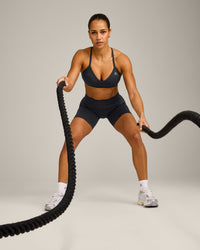 EnhanceLift™ Seamless Strappy Sports Bra with Grey Logo | Coal