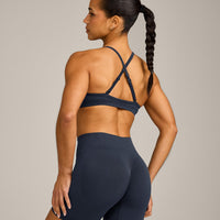 EnhanceLift™ Seamless Strappy Sports Bra with Grey Logo | True Blue