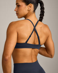 EnhanceLift™ Seamless Strappy Sports Bra with Grey Logo | True Blue