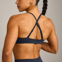EnhanceLift™ Seamless Strappy Sports Bra with Grey Logo | True Blue