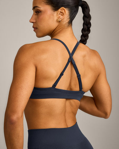 EnhanceLift™ Seamless Strappy Sports Bra with Grey Logo | True Blue