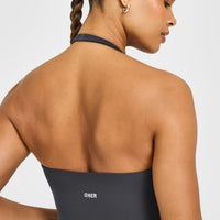 SoftMotion™ Halter Neck Mid Vest with Built in Bra Shelf with White Logo | Coal