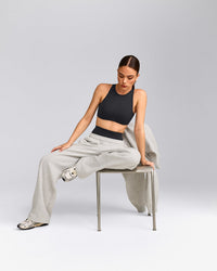 SoftMotion™ High Neck Sports Bra with Gray Logo | Coal