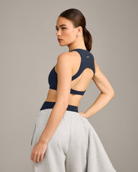 SoftMotion™ High Neck Sports Bra with Grey Logo | True Blue