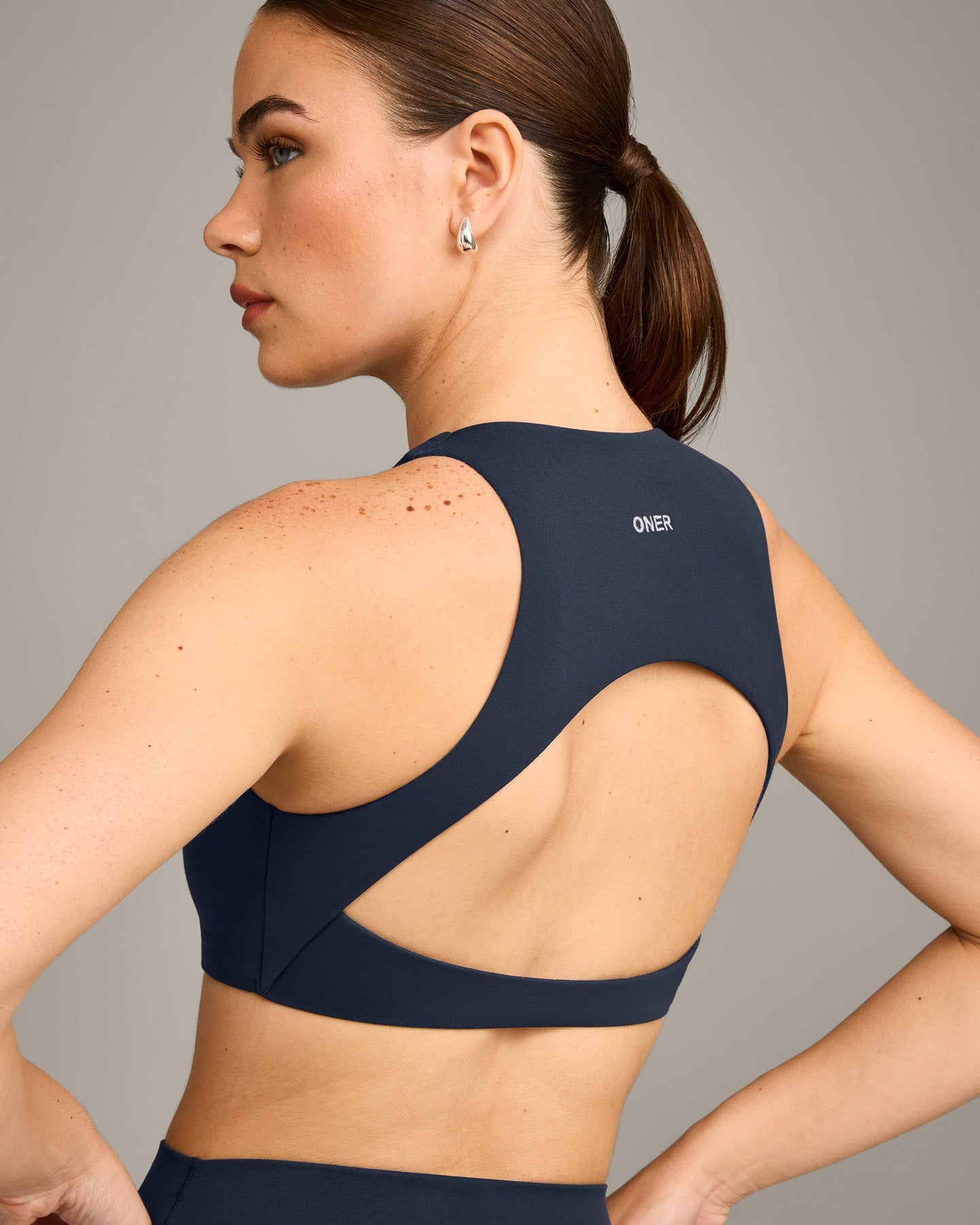 SoftMotion™ High Neck Sports Bra with Grey Logo | True Blue