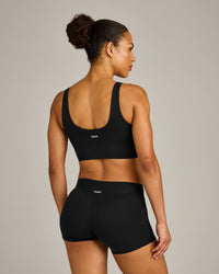 SoftMotion™ Longline Sports Bra with Grey Logo | Black