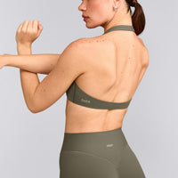 SoftMotion™ Minimal Halter Neck Bralette with Grey Logo | Alpine Green