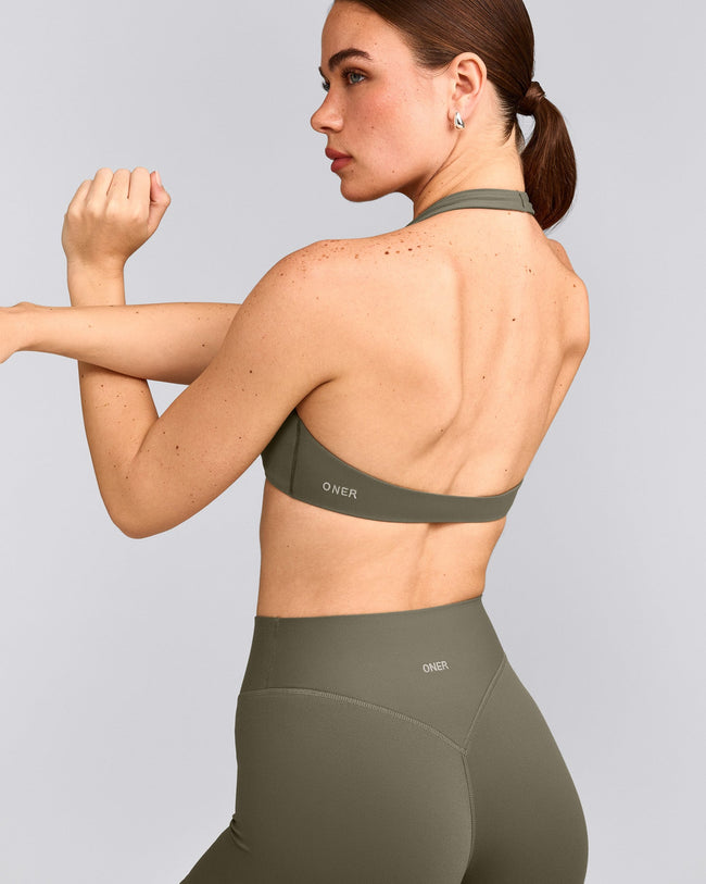 SoftMotion™ Minimal Halter Neck Bralette with Grey Logo | Alpine Green