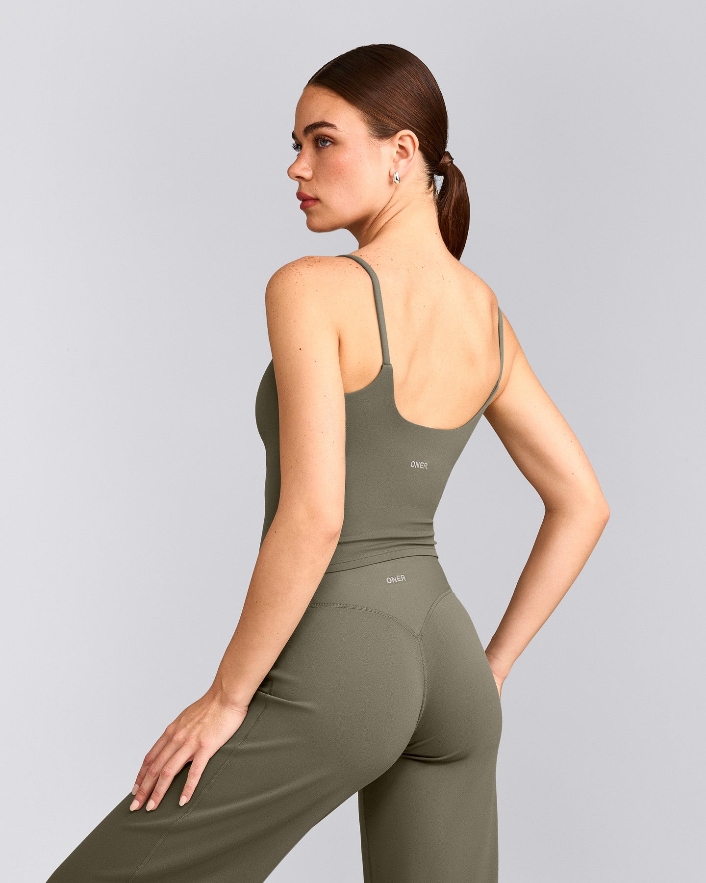 SoftMotion™ Strappy Mid Vest with Built in Bra Shelf with Grey Logo | Alpine Green