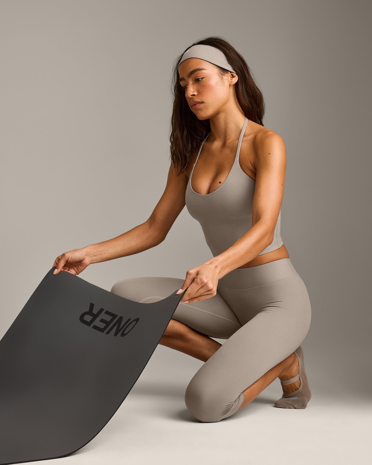 SoftMotion™ High Waisted Capri Leggings with White Logo | Warm Sand