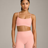 SoftMotion™ Strappy Sports Bra with Grey Logo | Peach Orange