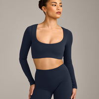 SoftMotion™ Scoop Neck Long Sleeve Crop Top with Built in Bra Shelf with Grey Logo | True Blue