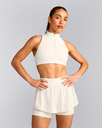 EasyLift™ Zip High Neck Sports Bra with Gray Logo | Marshmallow White