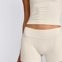 SoftMotion™ Double Layer Mid Rise Shorts 4" with Grey Logo | Marshmallow White