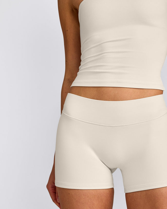 SoftMotion™ Double Layer Mid Rise Shorts 4" with Grey Logo | Marshmallow White