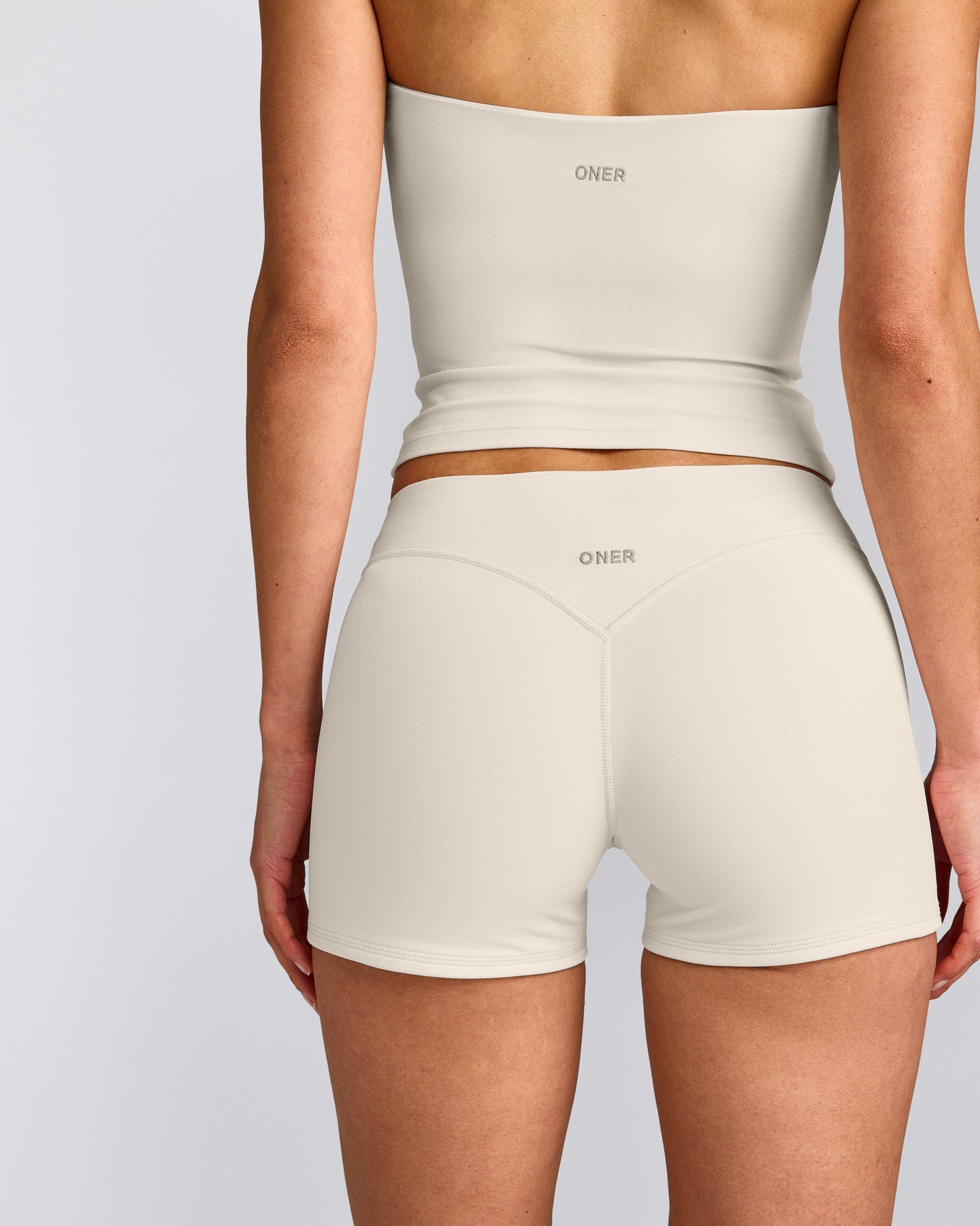 SoftMotion™ Double Layer Mid Rise Shorts 4" with Grey Logo | Marshmallow White